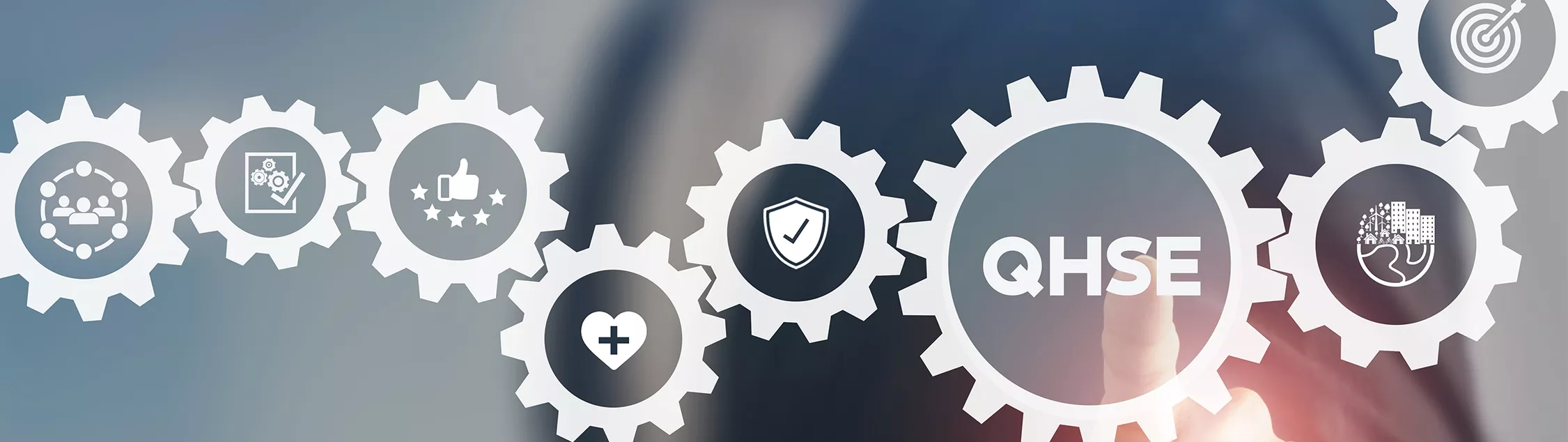 Header image of cogs in QHSE process