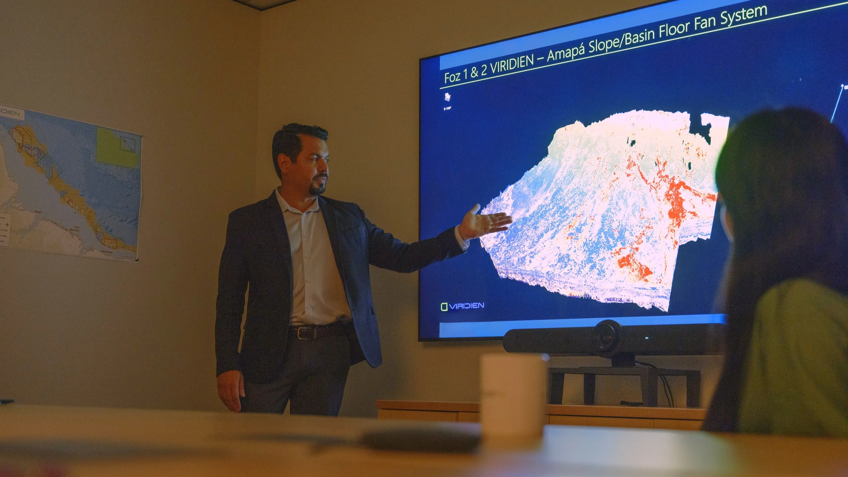 Image of Viridien Geologist discussing an image Geological Data 